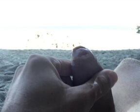 Slow motion cumshot on public beach