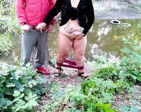 Curvy MILF with big ass masturbating jerking off big cock outdoors