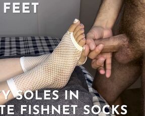 Dirty soles in white fishnet socks get covered with cum