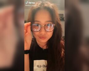 Tik Tok Female: Cute asian american nerd dancing.