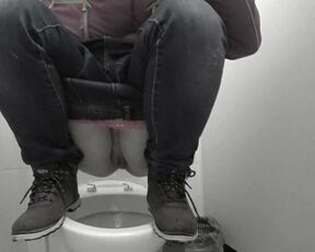 Pissing in a public toilet mature milf.